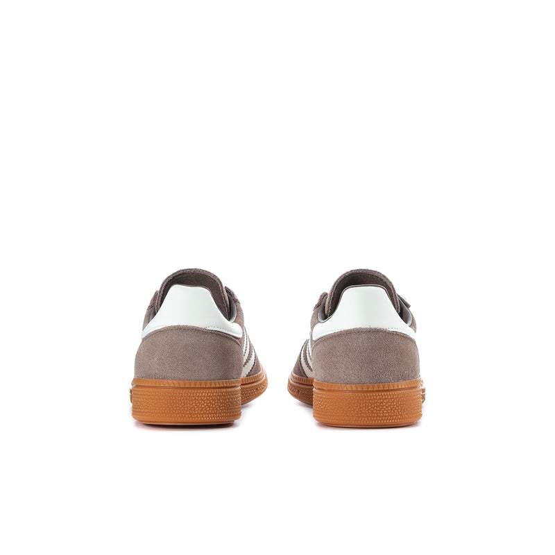 Youth sneakers, brown heel backs with cream collar and orange gum soles.