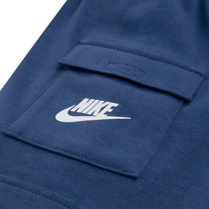 Navy cargo shorts pocket with sewn label and Nike swoosh logo.