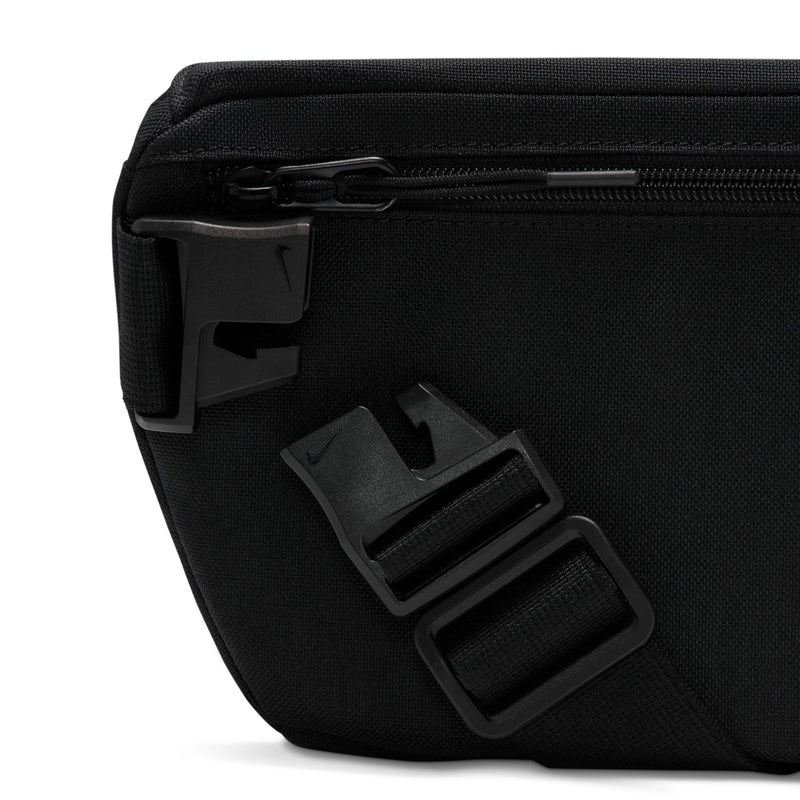 Black waist pack close-up of buckle and webbing strap attachment hardware.