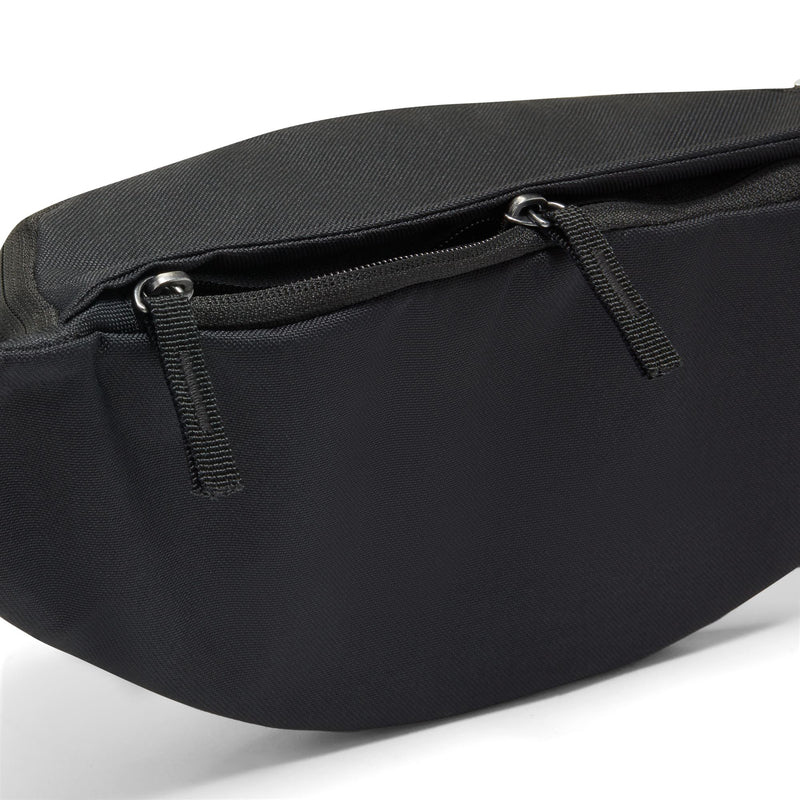 Black waist pack close-up: zip pull and textured fabric
