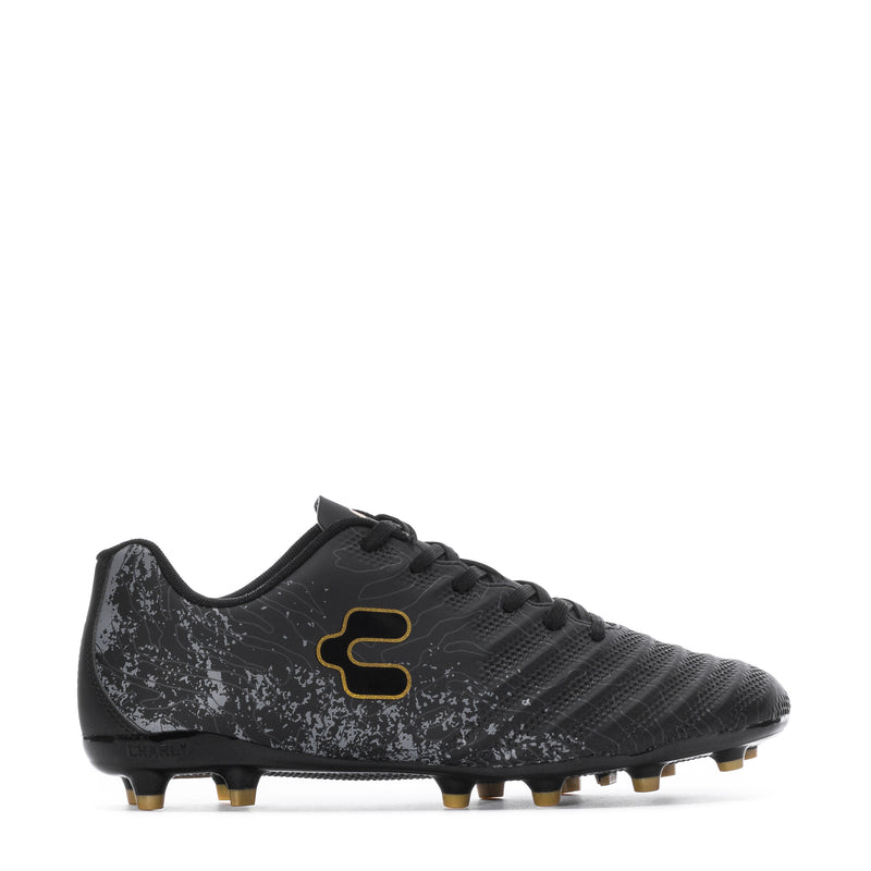 Men's black soccer cleat, side profile with textured pattern and gold emblem