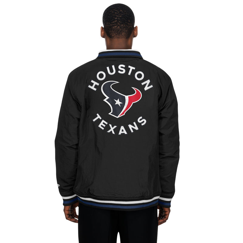 Black nylon track jacket with Houston Texans lettering and bull logo on back