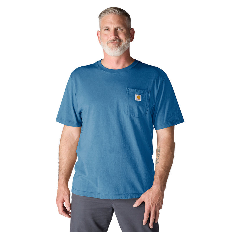 Men's loose-fit horizon blue tee with chest pocket and short sleeves, worn by model