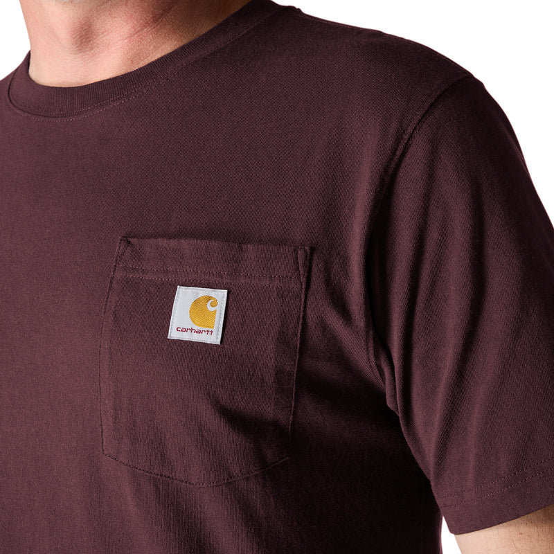 Chest pocket on dark port maroon loose-fit tee with logo label patch.