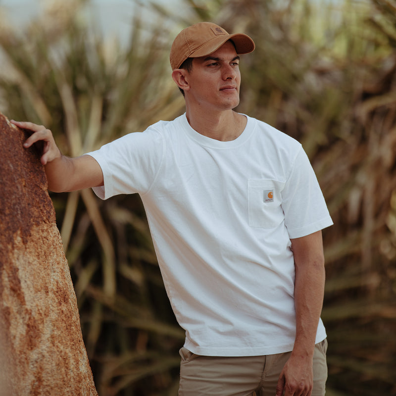 White men’s loose-fit pocket tee with chest logo patch and crew neck
