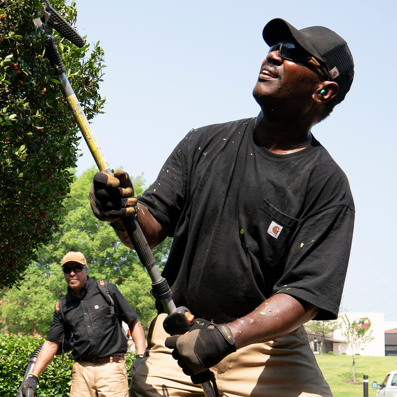 Black men’s pocket tee worn with front chest pocket and Carhartt logo patch