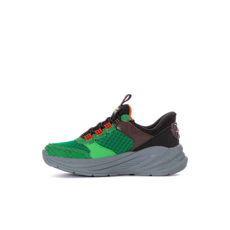 Kids green and black sneakers with orange lace panel and thick gray sole