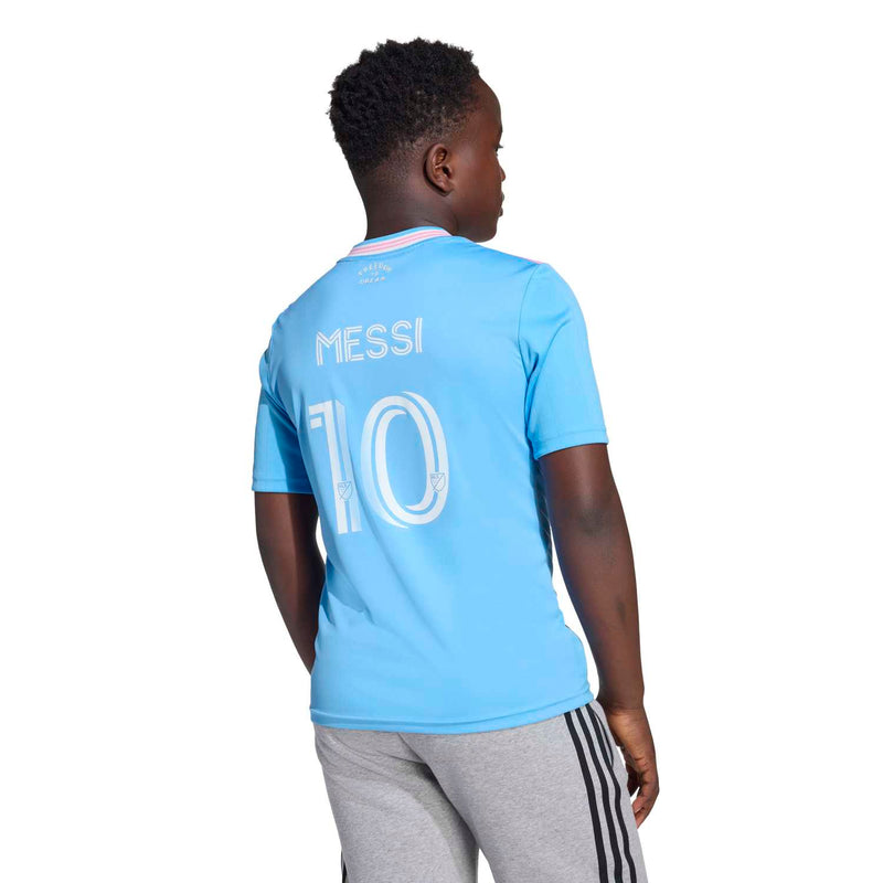 Youth light-blue soccer jersey back view with 'MESSI' and '10'