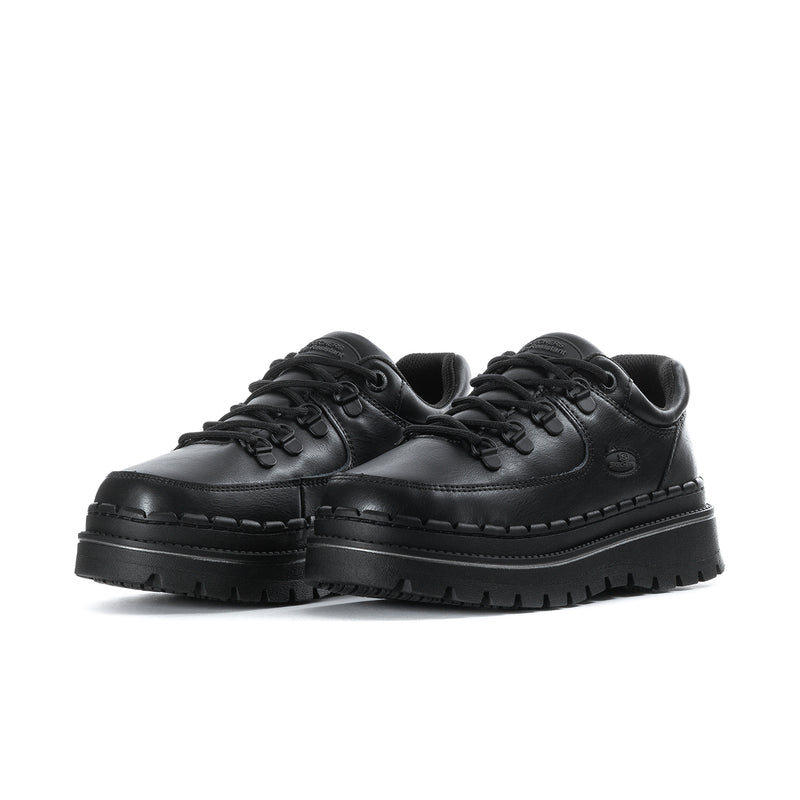 Women's black slip-resistant lace-up sneaker, toe-on view with thick tread