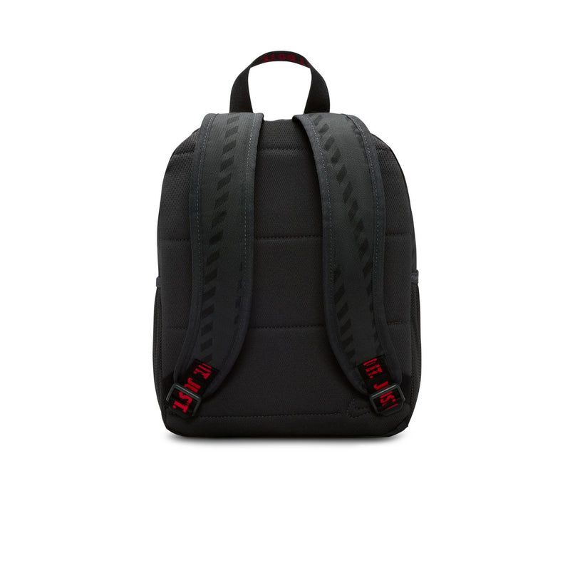 Mini black backpack with padded shoulder straps and red Nike branding tabs