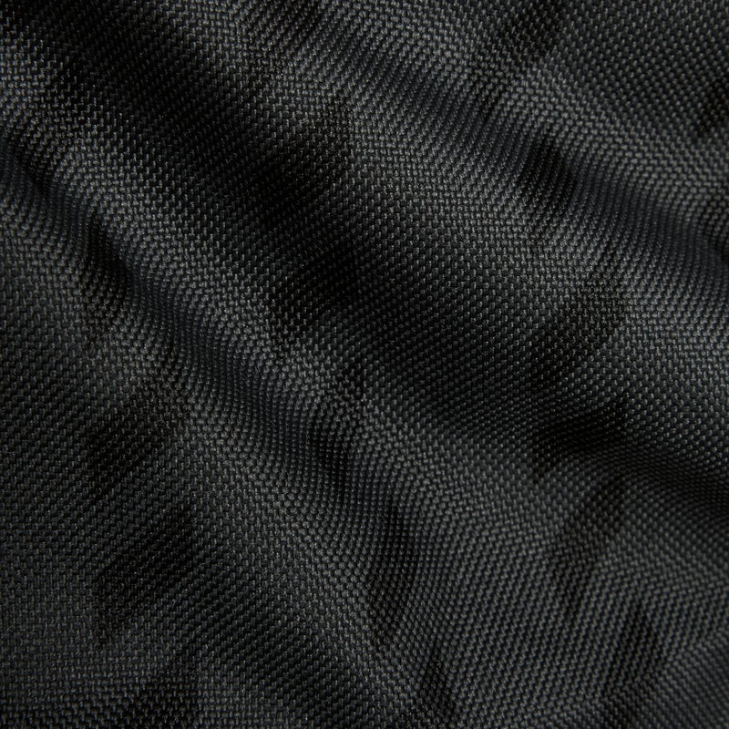 Black woven backpack fabric with subtle embossed pattern