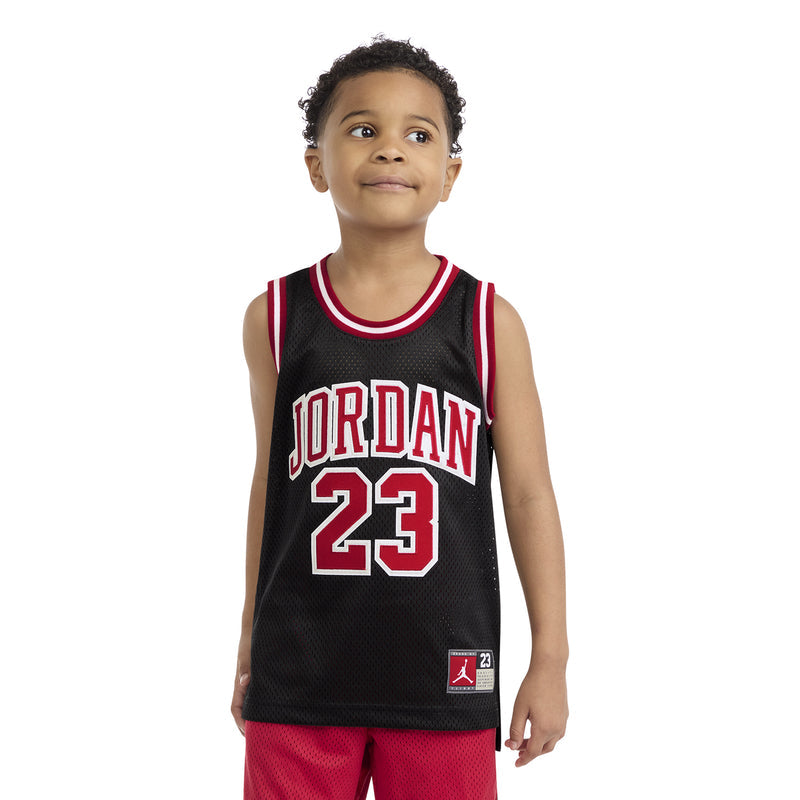 Kids black basketball jersey with 'JORDAN 23' front graphic and red-and-white trim