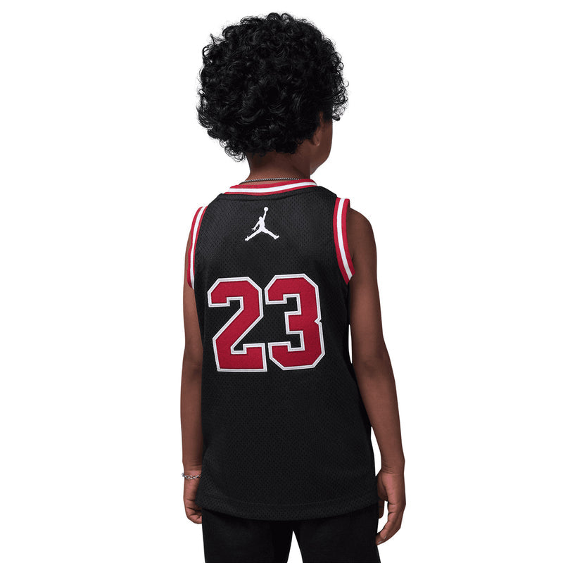 Kids black basketball jersey back with '23' print and Jumpman logo, red-and-white trim