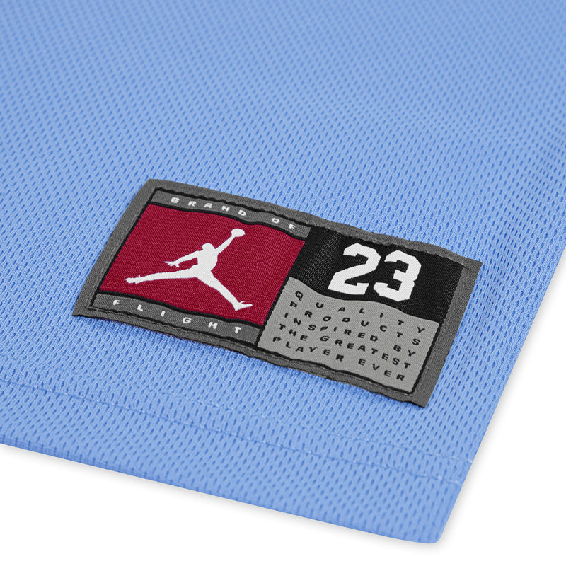 Jordan logo label and '23' patch on blue jersey fabric