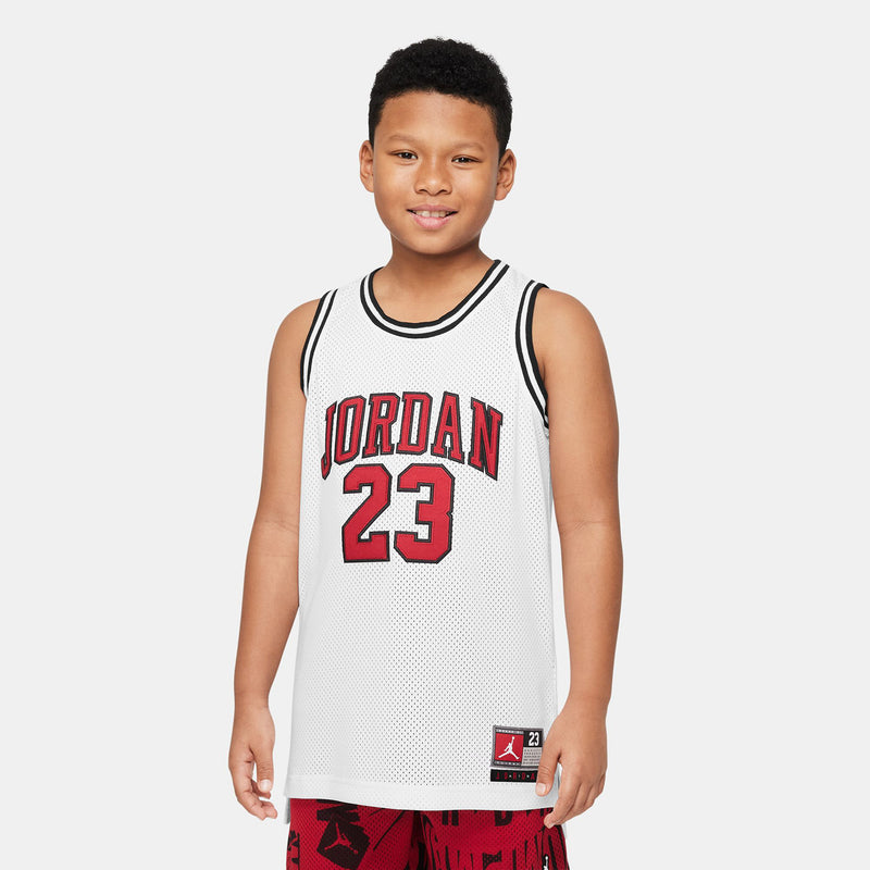White youth basketball jersey with red 'JORDAN 23' front and black collar trim