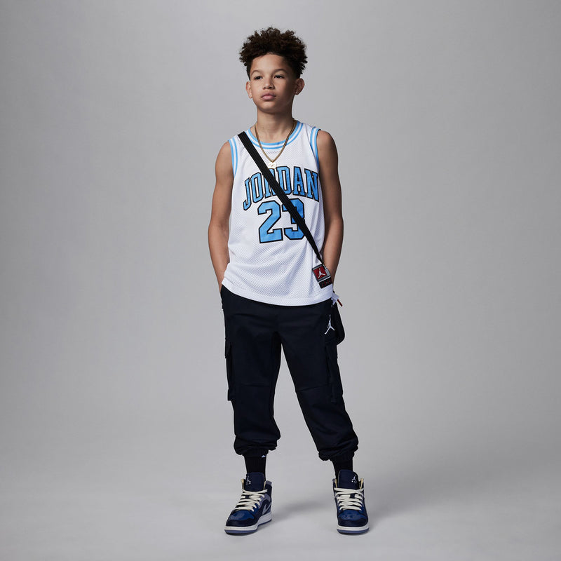 White youth basketball jersey with Jordan 23 front print and light blue trim