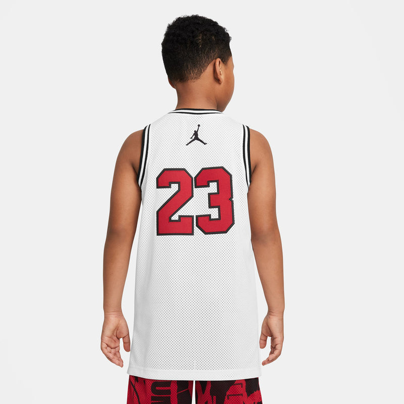White youth basketball jersey back with '23' number and black Jordan logo at neck