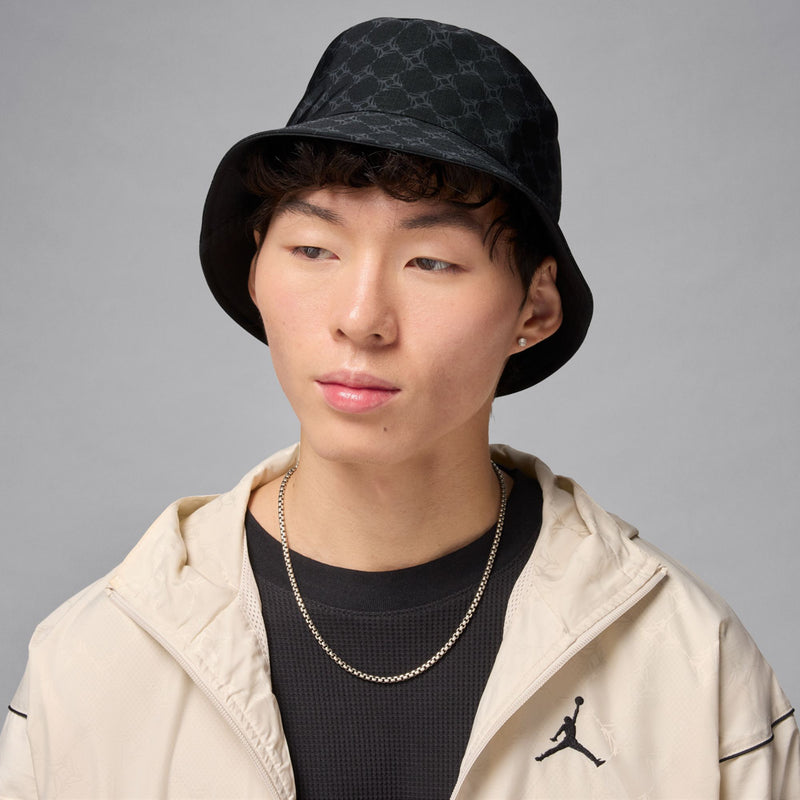 Black bucket hat with dark grey pattern; Jordan Jumpman logo on front