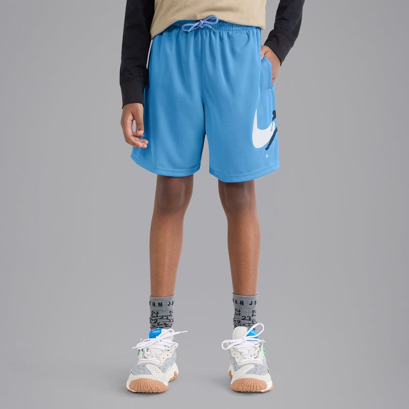 Youth blue mesh shorts on model, elastic waistband with drawstring and side Jordan logo