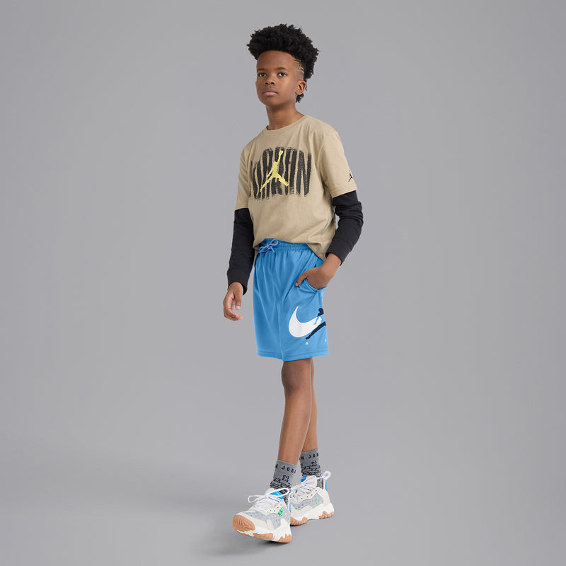 Youth blue mesh shorts worn by model, elastic waist with drawstring and side Jordan logo