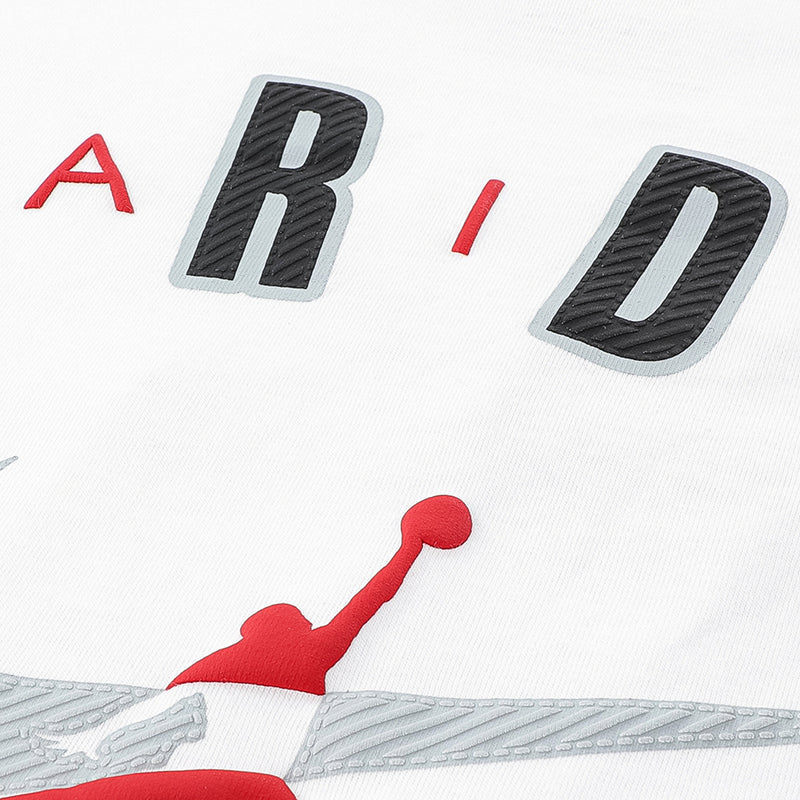 White youth Jordan tee close-up of arch lettering with red Jumpman logo