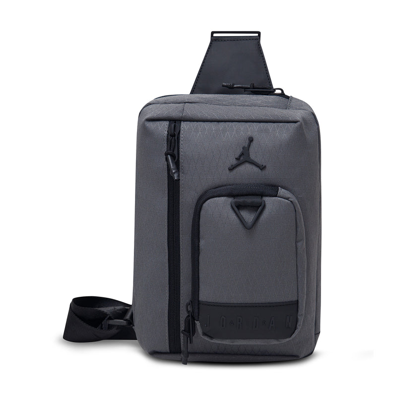 Iron grey crossbody bag with Jordan logo, top carry handle and adjustable strap