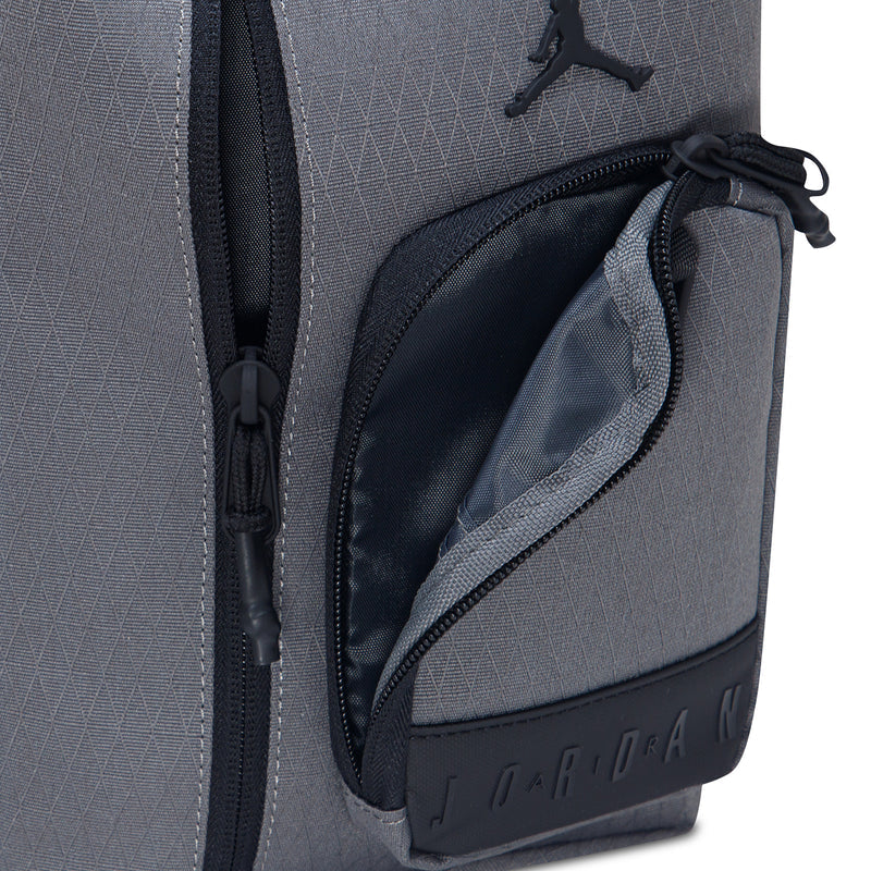 Iron grey crossbody bag with side zip pocket and embossed Jordan branding label