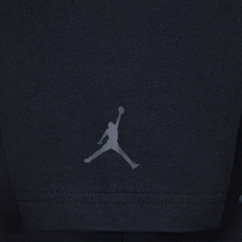 Black youth T-shirt with small gray Jumpman logo at hem