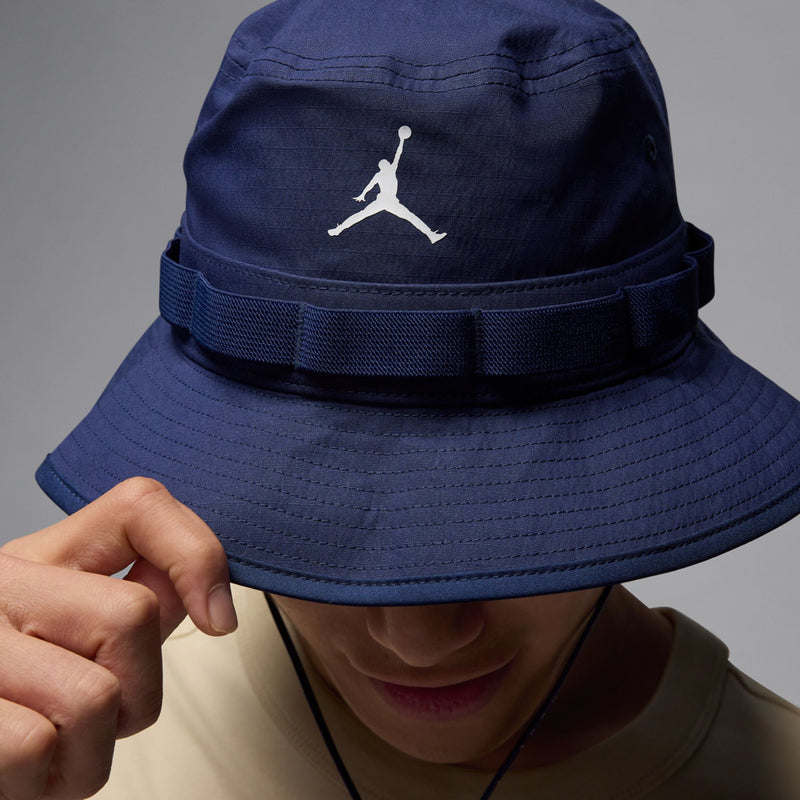 Jordan Jumpman navy bucket hat with white logo; textured brim and chin strap