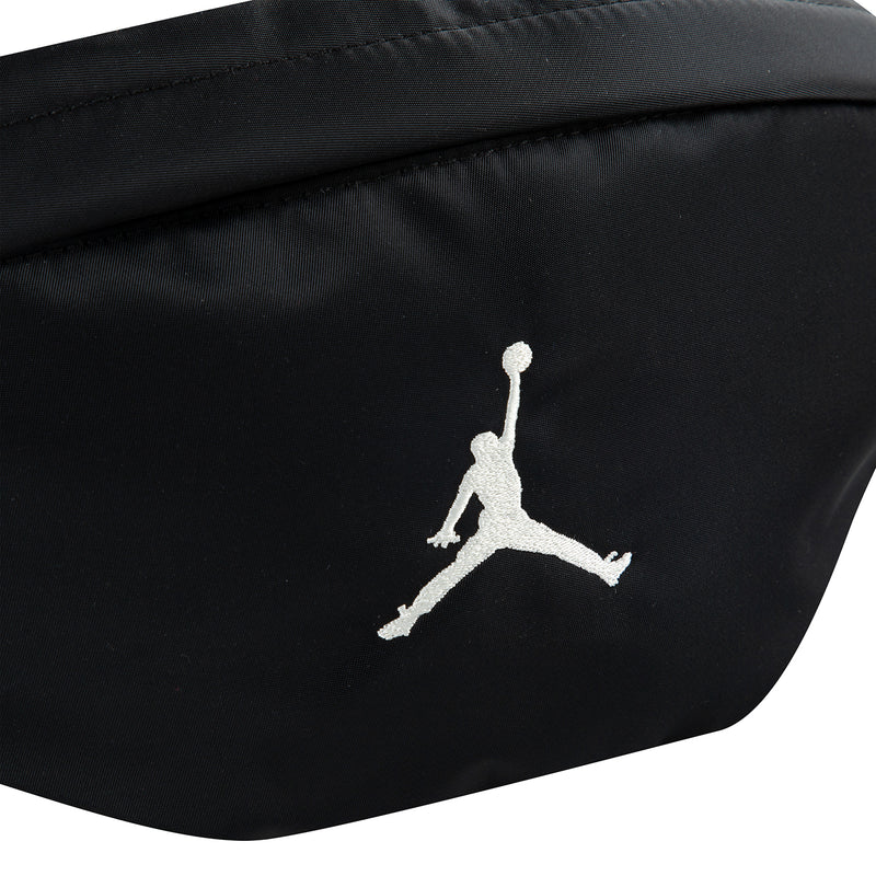 Black crossbody waist bag with white Jumpman logo on the front