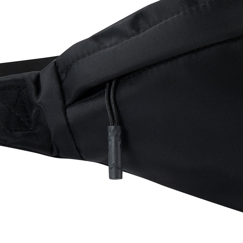 Black crossbody waist bag with zipper seam detail and fabric edge