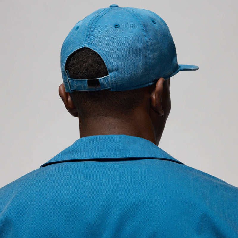 Faded blue strapback cap back view with adjustable fabric strap
