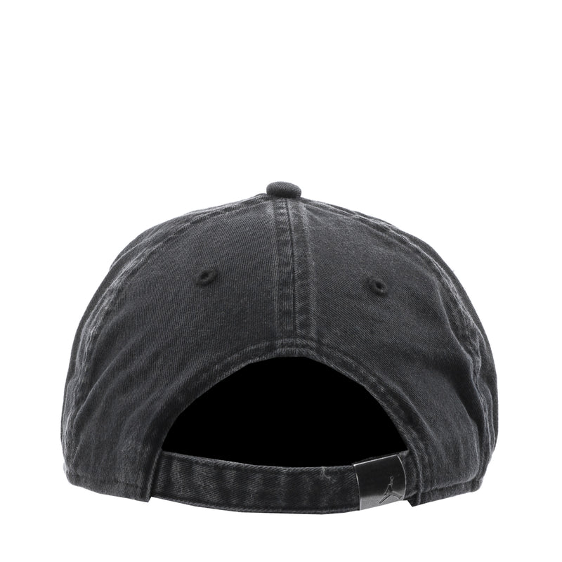 Dark 5-panel cap, back view showing stitched panels and ventilation eyelets