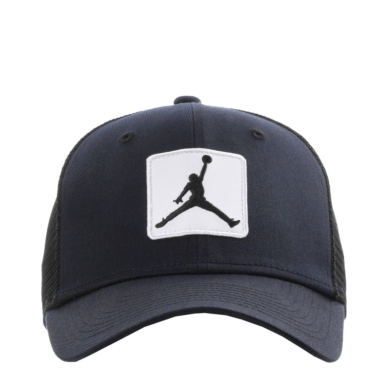 Black trucker cap with white Jumpman patch on the front panel