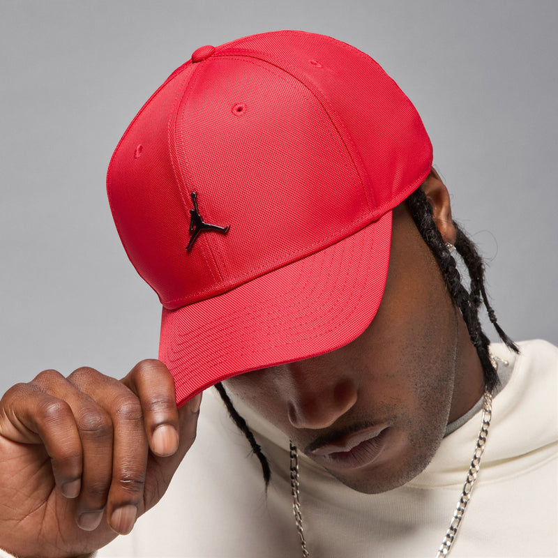 Red curved-bill cap with embroidered Jumpman logo, side view