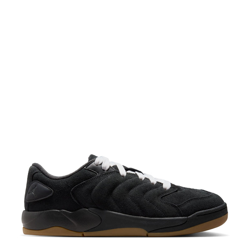 Black men’s sneakers with white laces and gum outsole, low-top lace-up style
