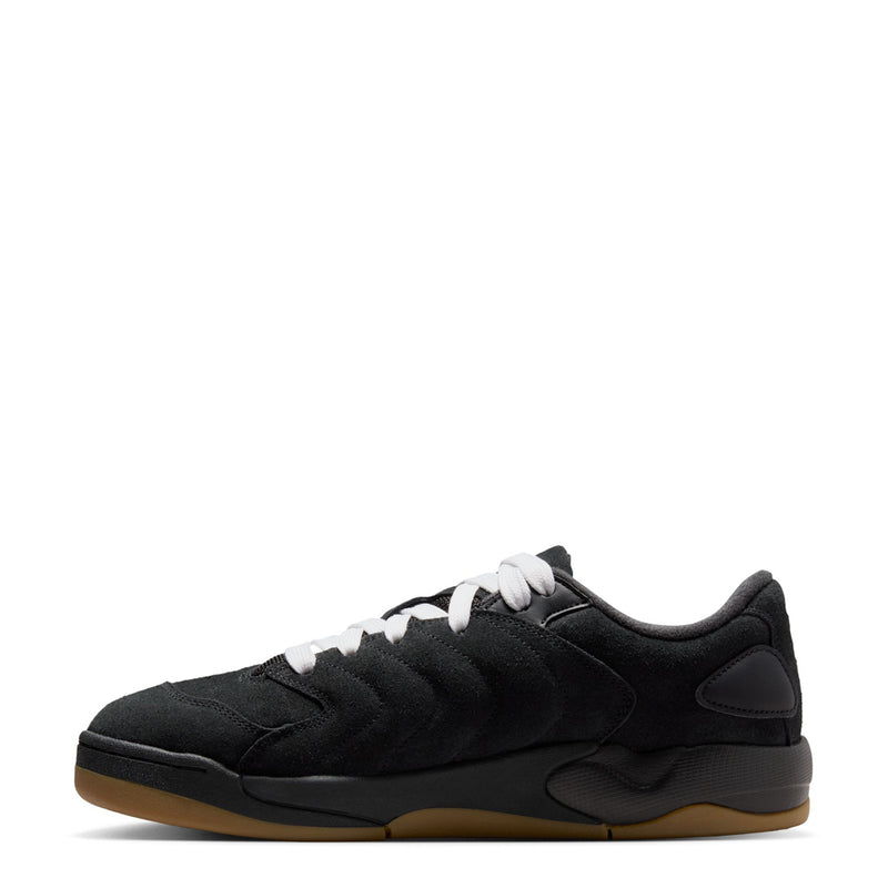Black low-top sneakers with white laces, quilted side panels, gum outsole