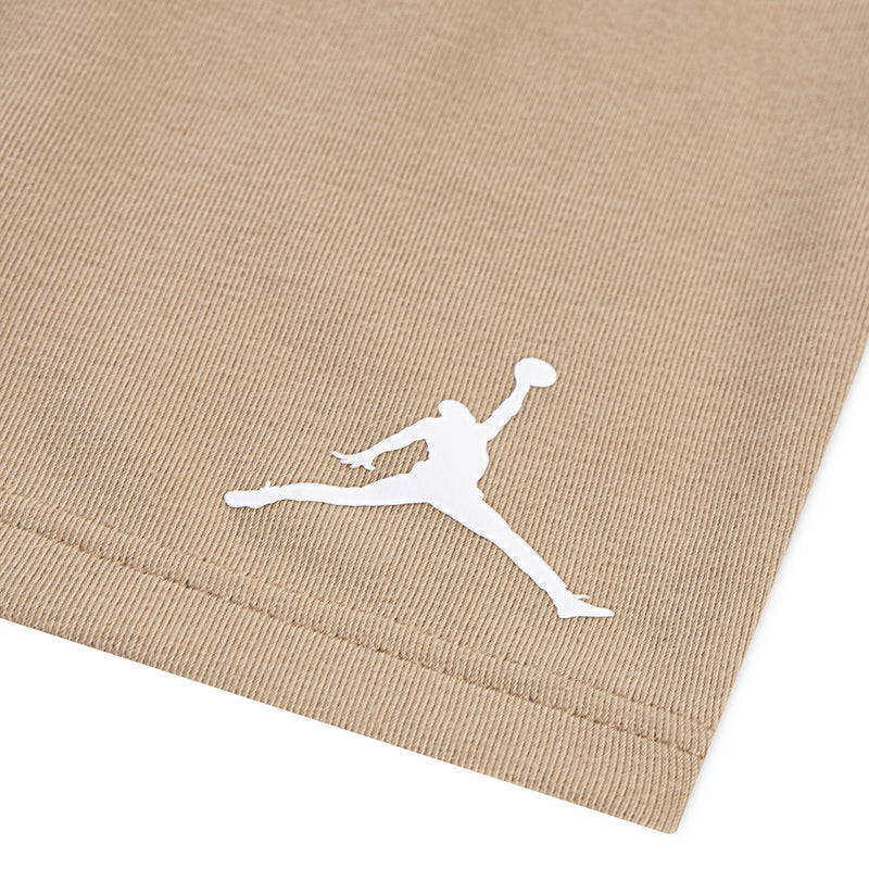 Kids tan shorts with white Jumpman logo and ribbed waistband
