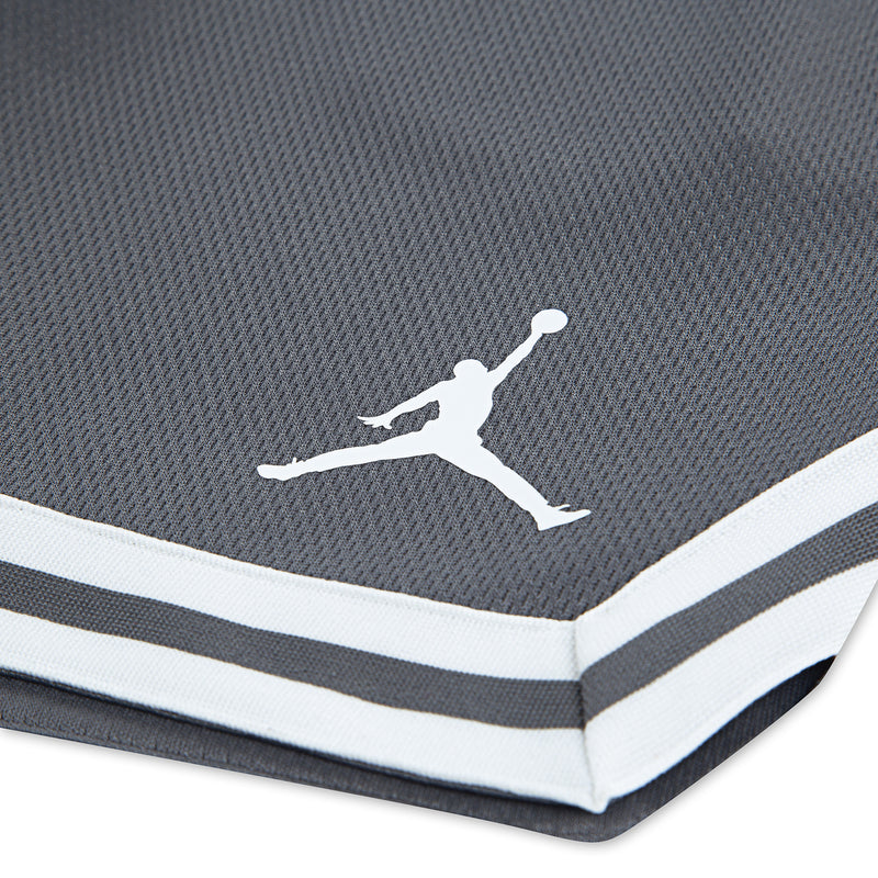 Youth smoke grey shorts close-up: white striped taping and Jumpman graphic