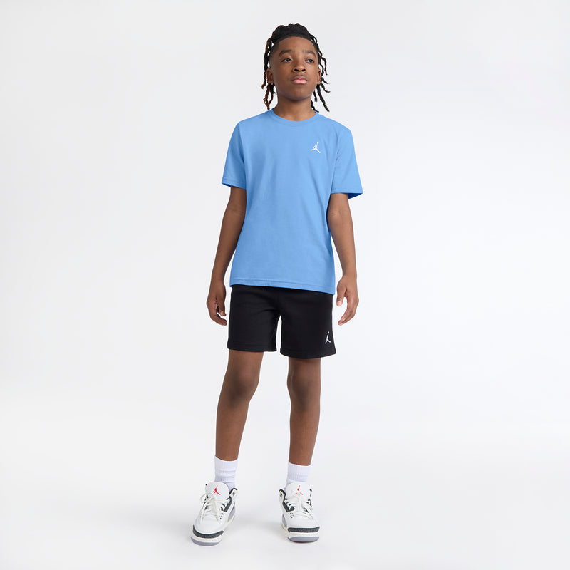Youth crewneck T-shirt in University Blue with small white Jumpman logo