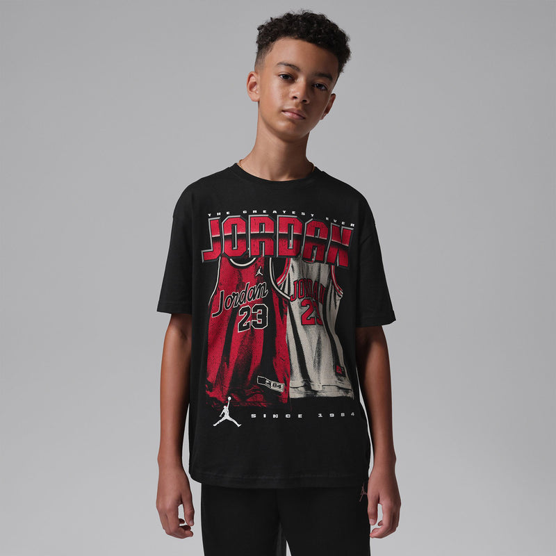 Youth black Jordan graphic T-shirt worn by teen, crew neck short sleeves