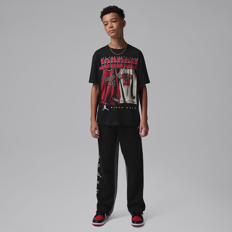 Youth black crew-neck Jordan graphic T-shirt and black pants, front view