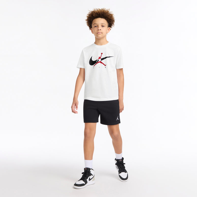 Youth white crew-neck t-shirt with Nike swoosh and red Air Jordan graphic