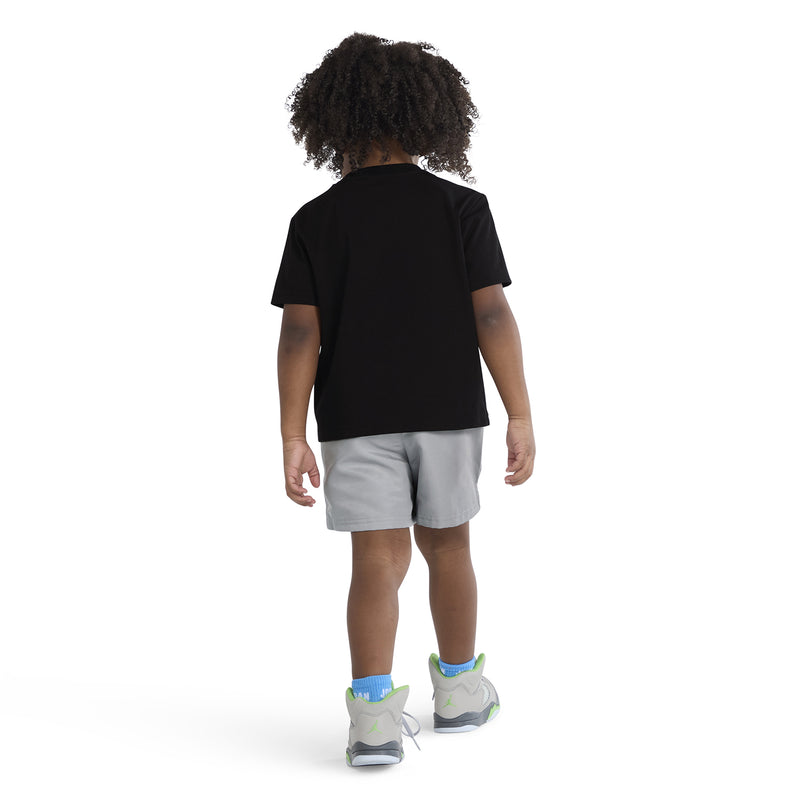 Toddler two-piece set from behind: black T-shirt and light gray pull-on shorts