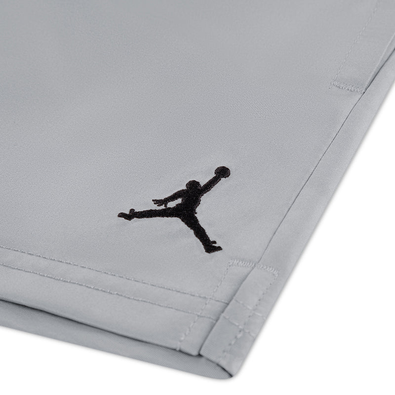 Light gray shorts leg with black Jumpman logo and stitched hem detail