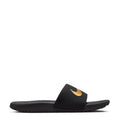 Kids' black slide sandals with gold Nike swoosh on the footbed