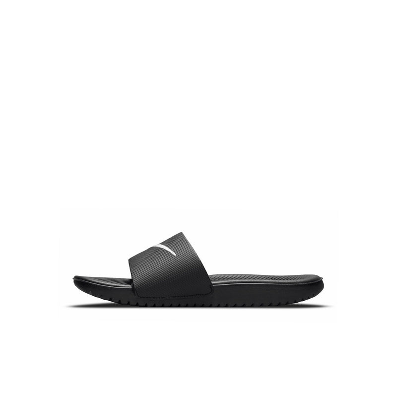 Kids black slide sandal with textured footbed and white Nike swoosh detail