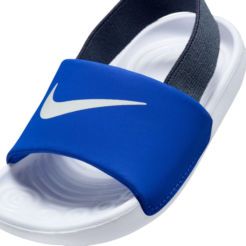 Toddler blue slide sandal close-up with Nike swoosh and white foam footbed