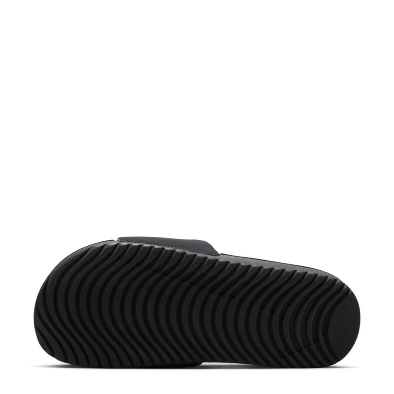 Youth black slide sandals outsole tread, textured rubber sole underside