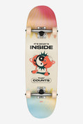 Top view of a Kids Wide Mid Inner Balance complete skateboard with a pink to yellow gradient deck and a cartoon graphic